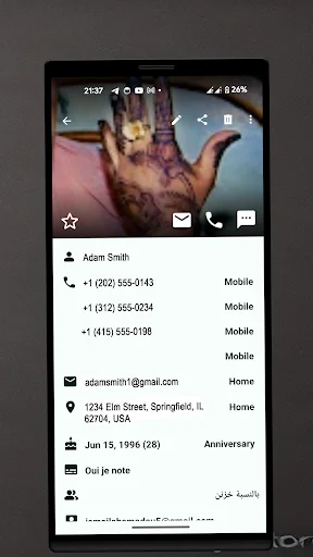 Contacts plus detailed contact view showing Adam Smith's profile with phone numbers, email, address, and birthday information