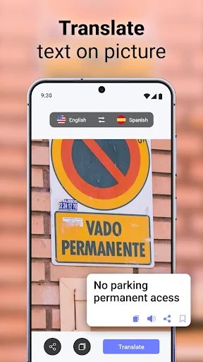 Camera translator feature translating Spanish 'VADO PERMANENTE' sign to English 'No parking permanent access' text