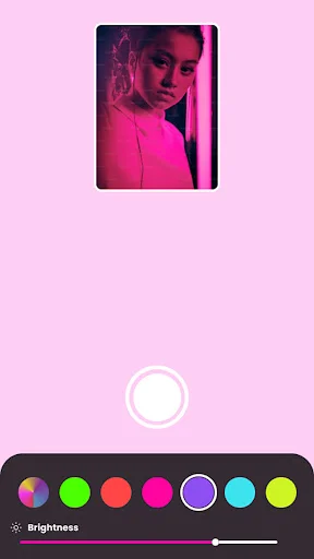 Full-screen selfie photo with pink glow lighting effect and color selection toolbar at bottom