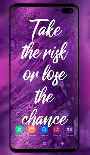 Purple wallpaper app showing motivational quote 'Take the risk or lose the chance' on sparkly violet background